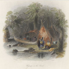Tipi et canot sur le bord d'une rivière.